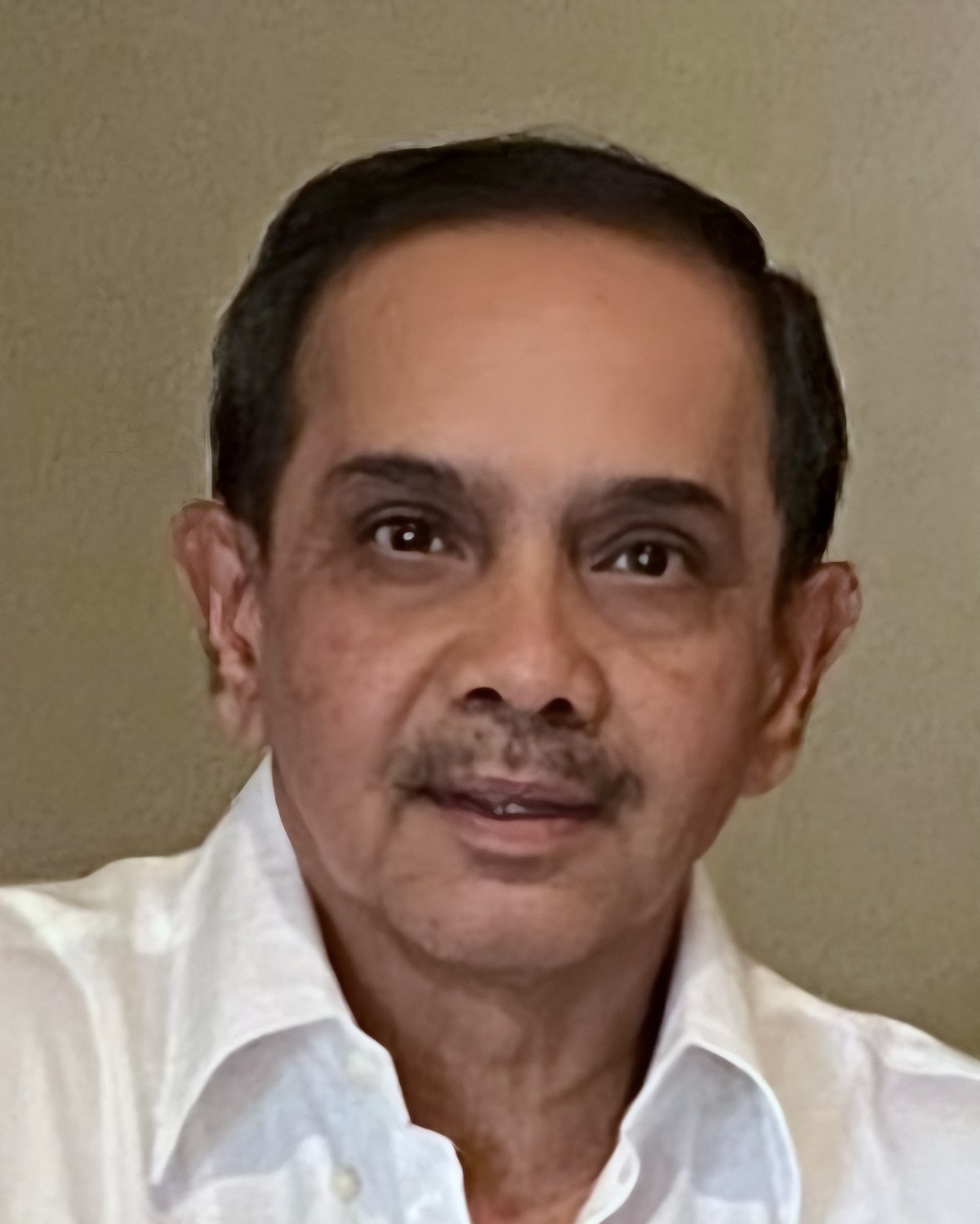 Portrait of Ravindra Mehta, founder of NEEL